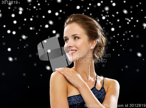 Image of smiling woman in evening dress