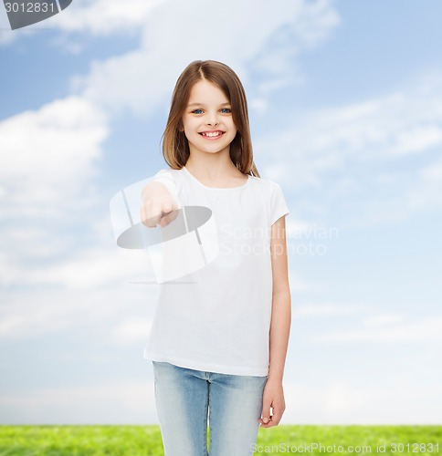 Image of smiling little girl in white blank t-shirt