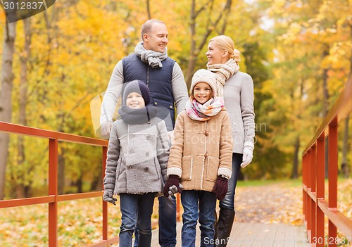 Image of happy family in autumn park