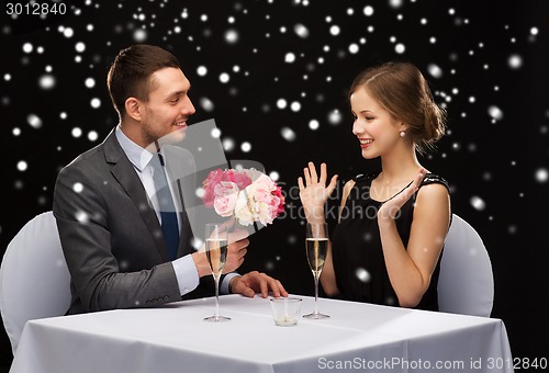 Image of smiling couple at restaurant