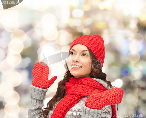 Image of smiling young woman in winter clothes