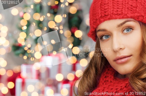 Image of close up of smiling young woman in winter clothes