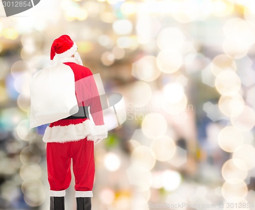 Image of man in costume of santa claus with bag