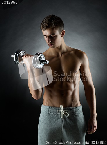 Image of young man with dumbbell