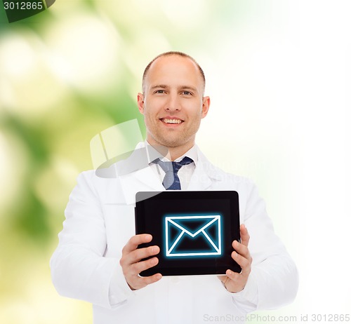 Image of smiling male doctor with tablet pc