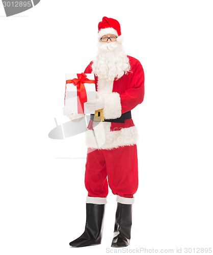 Image of man in costume of santa claus with gift box