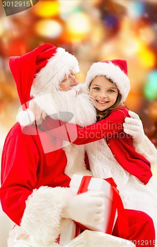 Image of smiling little girl with santa claus