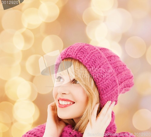 Image of smiling young woman in winter clothes