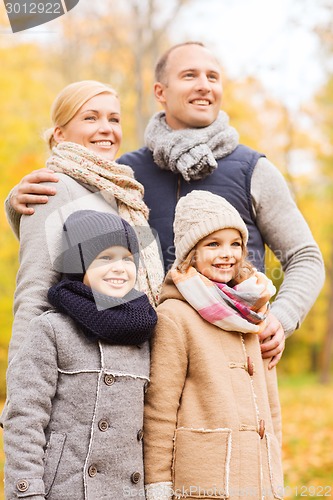 Image of happy family in autumn park