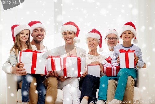 Image of happy family sitting on couch at home