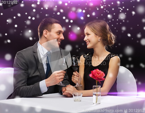 Image of smiling couple at restaurant