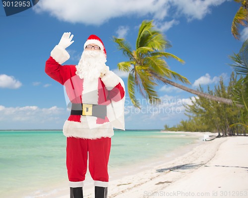 Image of man in costume of santa claus with bag