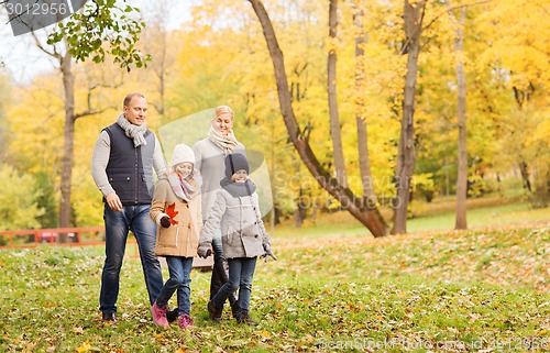 Image of happy family in autumn park