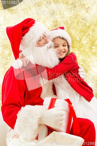 Image of smiling little girl with santa claus