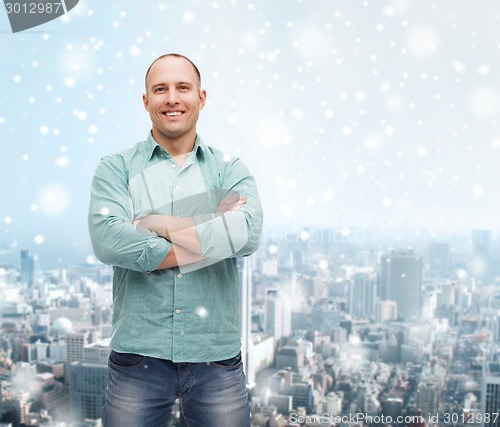 Image of smiling man with crossed arms
