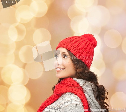 Image of smiling young woman in winter clothes