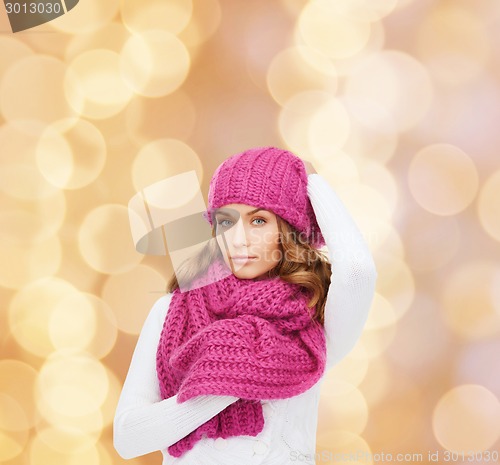 Image of smiling young woman in winter clothes