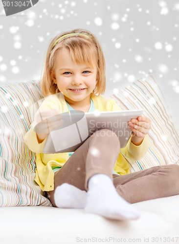 Image of smiling girl with tablet pc computer at home