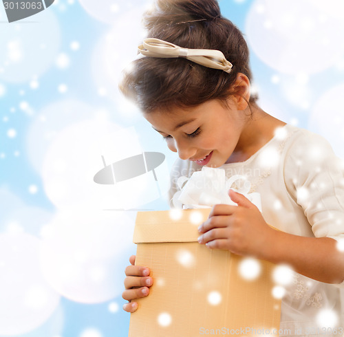 Image of smiling little girl with gift box