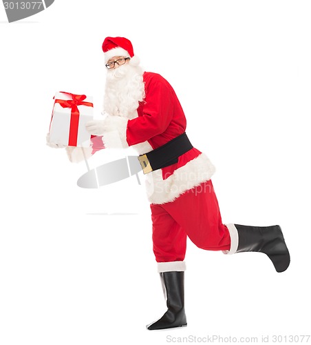 Image of man in costume of santa claus with gift box