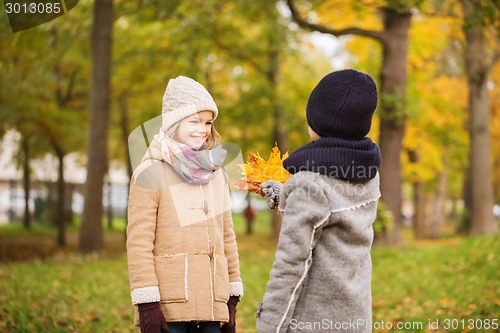 Image of smiling children in autumn park