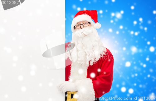 Image of man in costume of santa claus with billboard