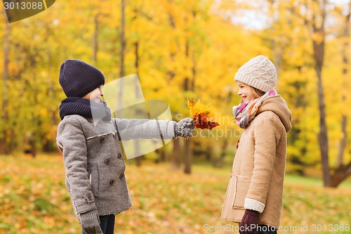 Image of smiling children in autumn park