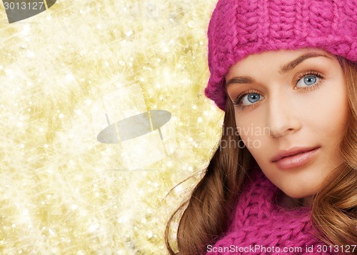 Image of close up of smiling young woman in winter clothes