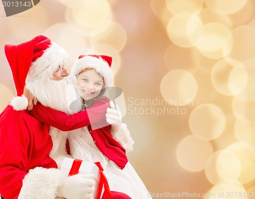 Image of smiling little girl with santa claus