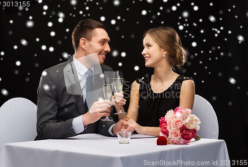 Image of smiling couple at restaurant