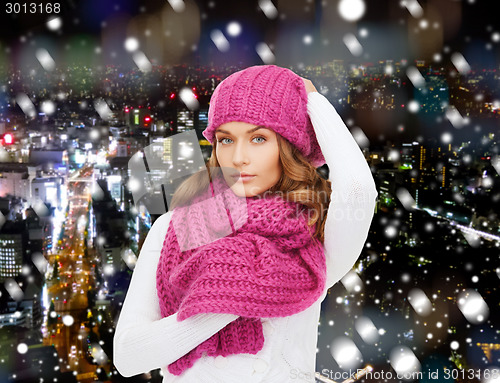 Image of smiling young woman in winter clothes