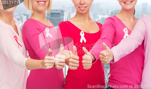 Image of close up of women with cancer awareness ribbons