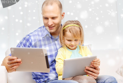 Image of happy father and daughter with tablet pc computer