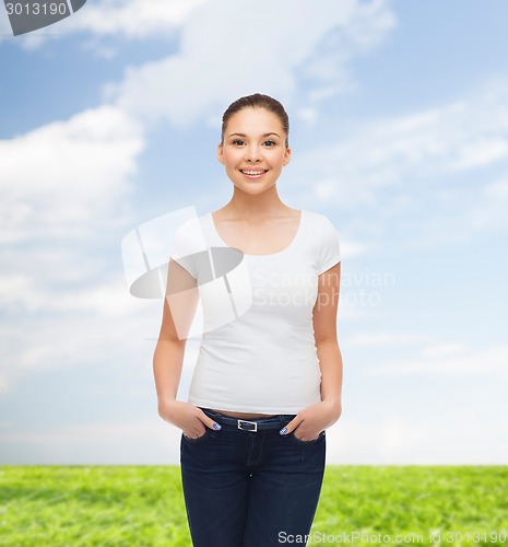 Image of smiling young woman in blank white t-shirt