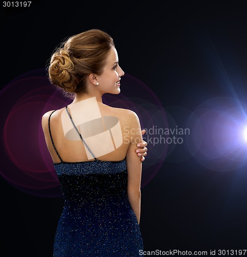 Image of smiling woman in evening dress