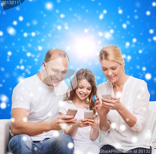 Image of happy family with smartphones