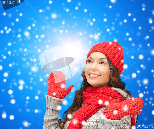 Image of smiling young woman in winter clothes