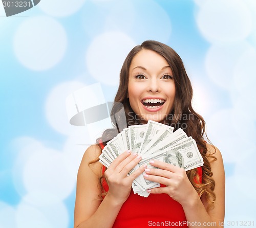 Image of woman in red dress with us dollar money