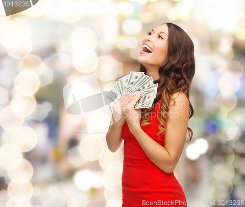 Image of woman in red dress with us dollar money