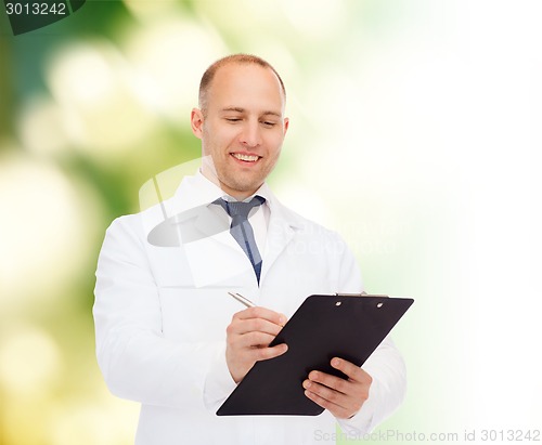 Image of smiling male doctor with clipboard