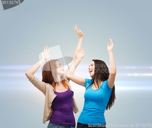 Image of smiling teenage girls having fun