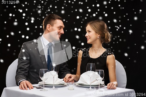 Image of smiling couple at restaurant