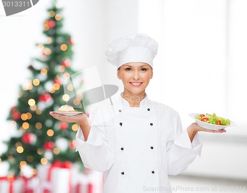 Image of smiling chef with cupcake and salad on plates