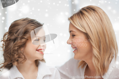 Image of happy mother and daughter talking