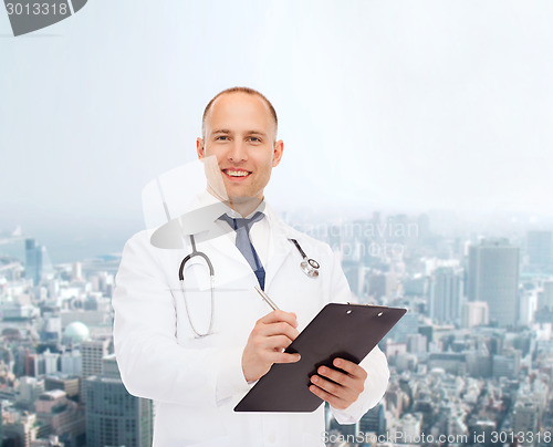 Image of smiling male doctor with clipboard and stethoscope