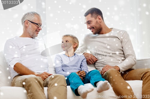 Image of smiling family at home