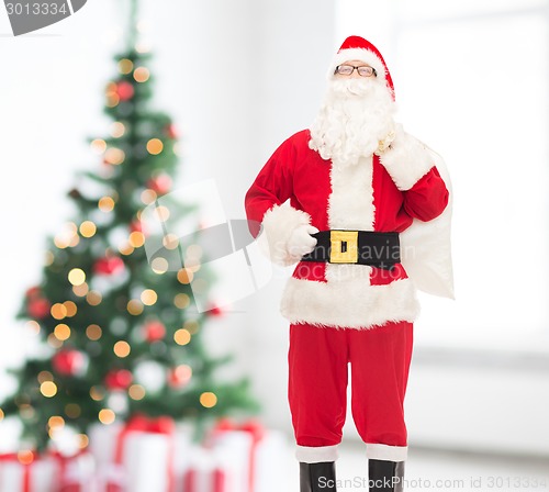 Image of man in costume of santa claus with bag