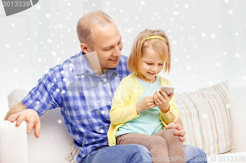 Image of happy father and daughter with smartphone