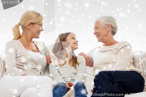 Image of smiling family at home