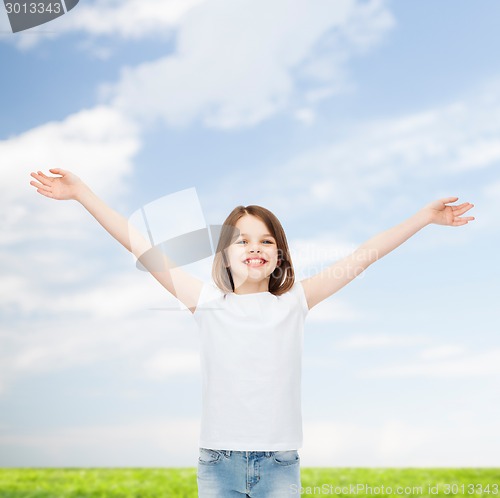 Image of smiling little girl in white blank t-shirt